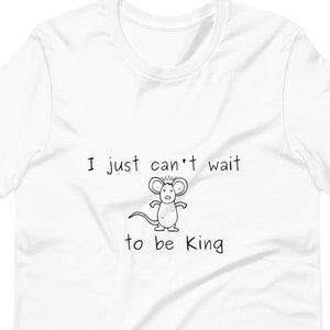 May include: White t-shirt with a black and white illustration of a mouse and the text "I just can't wait to be King."