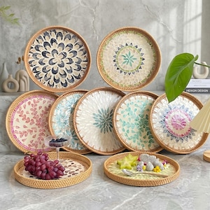 May include: A white ceramic mug with a black handle and the text "But First, Coffee" in a bold, black font. The mug is set against a neutral background, highlighting its simple design. The mug measures approximately 4 inches in height.