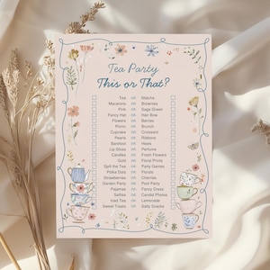May include: A rectangular game card titled Tea Party This or That? featuring a light pink background with a blue border, floral illustrations, and stacks of teacups. The text lists various choices like Tea or Matcha, Macarons or Brownies, and more.