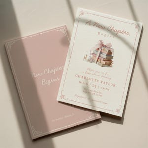 May include: Two baby shower invitations. One is light pink with the text "New Chapter Begins". The other is off-white with a stack of books and the text "A New Chapter Begins". Both have decorative borders.