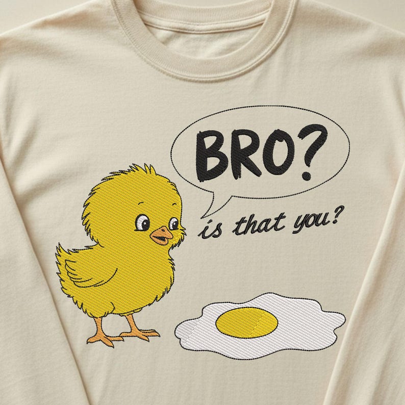 May include: Cream-colored long-sleeve shirt featuring an embroidered yellow chick with the text "BRO? is that you?" in a speech bubble. An embroidered fried egg is next to the chick. The shirt is made of a soft material.