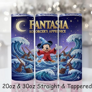 May include: A tumbler featuring a design from Disney's Fantasia. The design includes Mickey Mouse as the Sorcerer's Apprentice, surrounded by waves, brooms, and a crescent moon. The text "FANTASIA SORCERER'S APPRENTICE" is displayed in gold. Available in 20oz and 30oz sizes.
