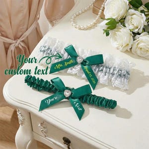 May include: A white ceramic mug with a black handle and the text "But First, Coffee" in a handwritten style. The mug is on a white surface. The mug is 4 inches tall.