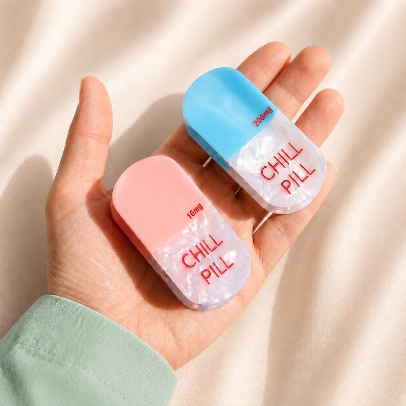 May include: Two pill-shaped containers with a smooth finish. One is light blue with 200mg printed on it, and the other is light pink with 16mg printed on it. Both feature a translucent white base with the red text CHILL PILL printed on the front.