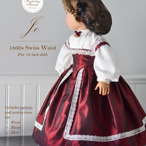 May include: A doll in a burgundy 1860s Swiss Waist dress with white lace trim and a matching bonnet. The outfit includes a waist, blouse, and skirt, designed for 45.7 cm dolls. The pattern is designed by Elizabeth Gearhart, with an intermediate skill level.