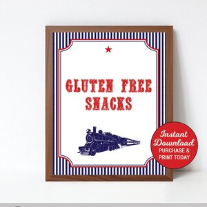 May include: A framed sign with the words "GLUTEN FREE SNACKS" in red, above a blue train illustration. The sign has a white background with red and blue accents and the text "Instant Download PDF File!" at the top.