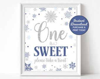 May include: Printable sign for a first birthday party with a winter theme. The sign is white with blue and silver snowflakes and says "One is Sweet" with the text "Please take a treat".