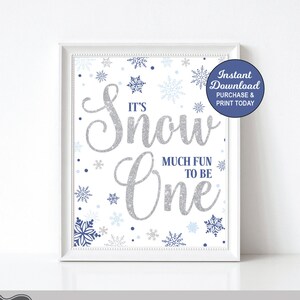 May include: Printable digital download for a first birthday party. The design features a white background with blue and silver snowflakes and the text "It's Snow One" with the words "Much Fun To Be" underneath.