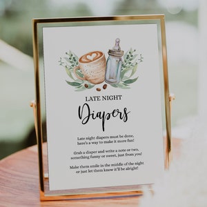 Pode incluir: Uma placa com moldura dourada, fundo branco e ilustrações de folhagem verde. A placa diz "Late Night Diapers" e inclui instruções para uma atividade divertida: "Late night diapers must be done, here's a way to make it more fun! Grab a diaper and write a note or two, something funny or sweet, just from you! Make them smile in the middle of the night or just let them know it'll be alright!"