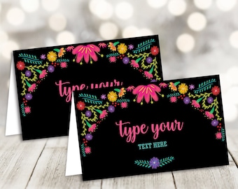 May include: Two black place cards with a floral border in bright colors. The text "Type your text here" is on the bottom card.