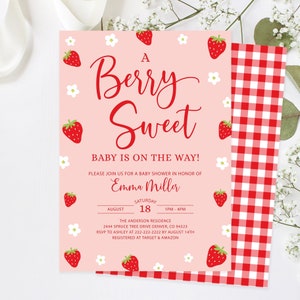 May include: A pink baby shower invitation with a red and white gingham pattern on the right side. The invitation features a strawberry theme with the text "A Berry Sweet Baby is on the Way!" and the name "Emma Miller". The invitation includes the date, time, and location of the shower.