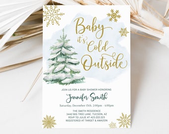 Op de afbeelding: Een witte kaart met een blauwe aquarel achtergrond en een gouden sneeuwvlok ontwerp. De tekst op de kaart luidt "Baby it's Cold Outside" en bevat details voor een babyshower ter ere van Jennifer Smith.