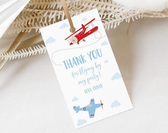 May include: Thank you for flying by my party!  A blue and red airplane thank you tag with a white background and blue clouds.