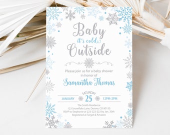 Op de afbeelding: Een baby shower uitnodiging met een winterthema. De uitnodiging heeft een blauw en zilveren sneeuwvlokkenontwerp met de tekst "Baby it's cold outside" en "Samantha Thomas". De uitnodiging bevat ook de datum en tijd van de babyshower, evenals de locatie en RSVP-informatie.