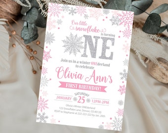 May include: A pink and silver snowflake-themed first birthday invitation with the text "Our little snowflake is turning ONE" and "Join us in a winter ONEderland to celebrate Olivia Ann's FIRST BIRTHDAY!" The invitation includes the date "JANUARY 25" and the time "12PM-2PM".
