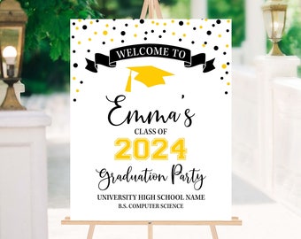 May include: A white welcome sign with black and gold confetti. The sign says "Welcome to Emma's Class of 2024 Graduation Party" with the name and year in gold. The sign also includes the text "University High School Name" and "B.S. Computer Science".