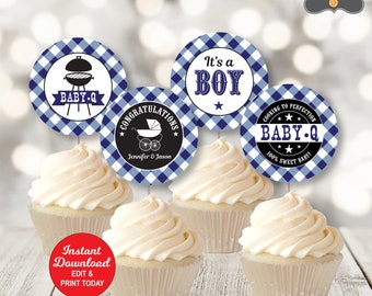 May include: Cupcakes topped with white frosting and decorative toppers. The toppers feature a blue and white checkered pattern with text that reads "Baby-Q", "It's a Boy", and "Congratulations". The image also includes the text "Instant Download".