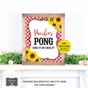 May include: A printable sign for a party game called "Pacifier Pong". The sign has a red and white gingham background with sunflowers. The text on the sign reads "Pacifier Pong Sink It Or Chug It". The sign is sold separately and the link is in the item details.