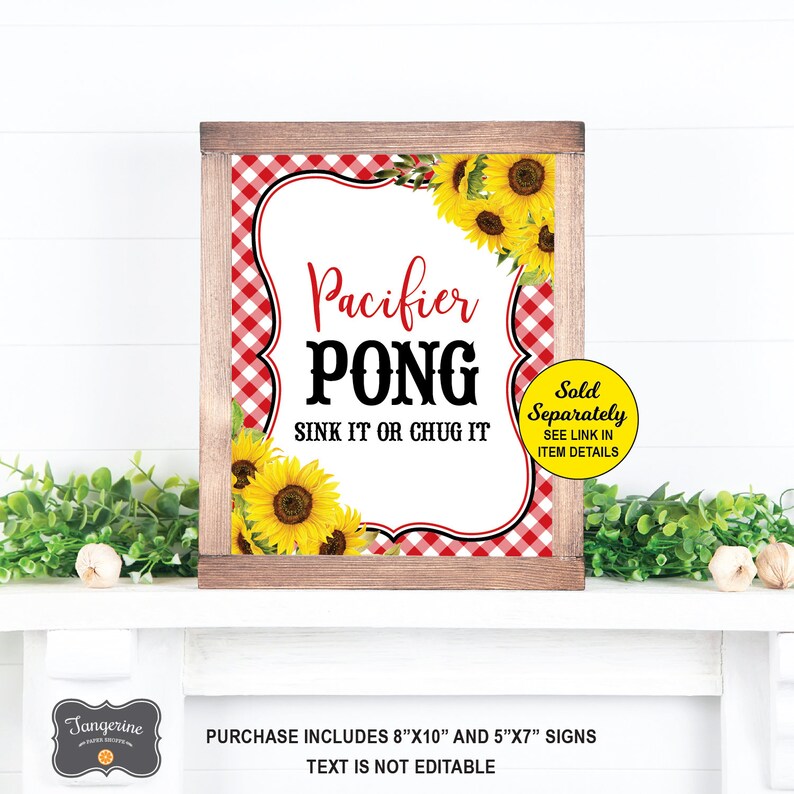 May include: A printable sign for a party game called "Pacifier Pong". The sign has a red and white gingham background with sunflowers. The text on the sign reads "Pacifier Pong Sink It Or Chug It". The sign is sold separately and the link is in the item details.