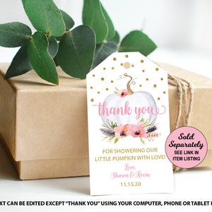 May include: A white pumpkin with pink flowers and gold glitter accents. The tag says "thank you" and "For showering our little pumpkin with love!" with the names "Sharon & Kevin" and the date "11.15.20". The tag also says "Sold Separately" and "See link in item listing".