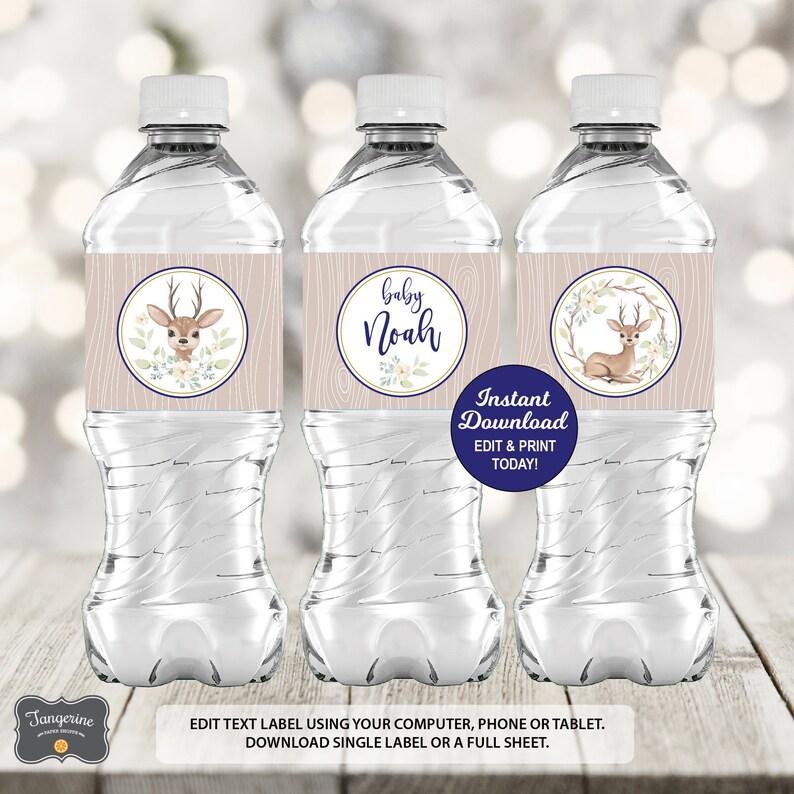 May include: Three water bottles with labels featuring a fawn with antlers and floral accents. The labels are beige with a woodgrain texture and blue accents. One label says "Baby Noah". The text "Instant Download EDIT & PRINT TODAY!" is on a blue tag.
