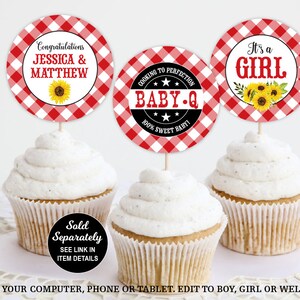 May include: Three red and white gingham cupcake toppers with black text. The toppers say "Congratulations Jessica & Matthew", "It's a Girl", and "Cooking to Perfection Baby-Q 100% Sweet Baby!"