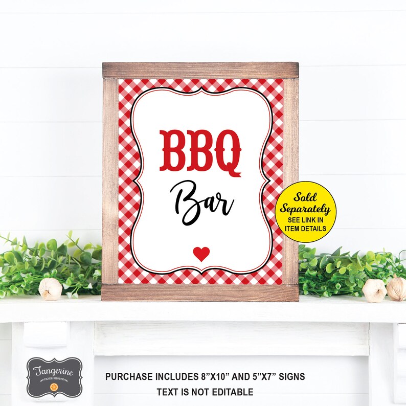 May include: A printable sign with a red and white gingham background. The sign says "BBQ Bar" in black text with a red heart at the bottom. The sign is framed in a brown wood frame. The text "Sold Separately SEE LINK IN ITEM DETAILS" is in a yellow circle on the right side of the sign.