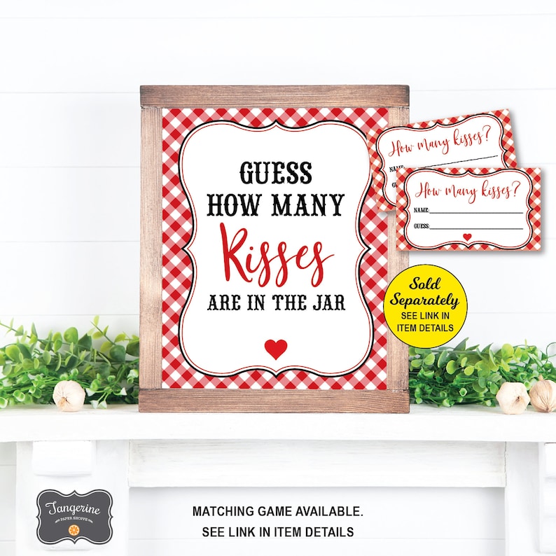 May include: A red and white gingham patterned sign with a wooden frame that says "Guess How Many Kisses Are In The Jar". There are two smaller red and white gingham patterned cards that say "How Many Kisses?" with a line for a name and a guess.