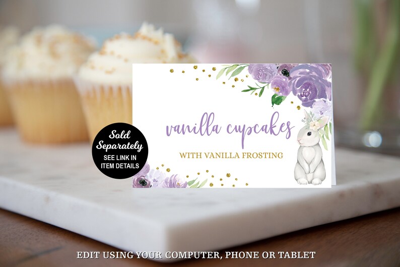 May include: Printable sign for a dessert table with a purple floral design and a white bunny. The sign reads "vanilla cupcakes with vanilla frosting".