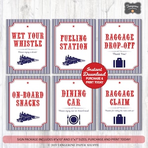 Puede incluir: Seis carteles imprimibles con temática de tren. Los carteles son rojo, blanco y azul con fondo a rayas. Los carteles dicen "Wet Your Whistle", "Fueling Station", "Baggage Drop-Off", "On-Board Snacks", "Dining Car" y "Baggage Claim".