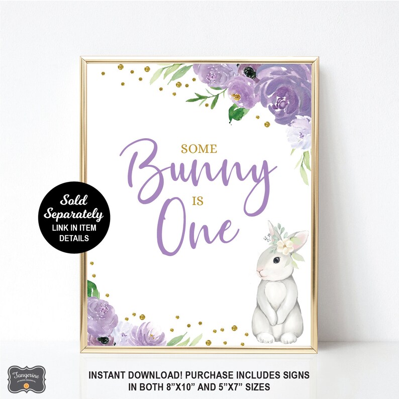 May include: Purple and gold floral printable sign with a bunny rabbit and the text "Some Bunny is One".