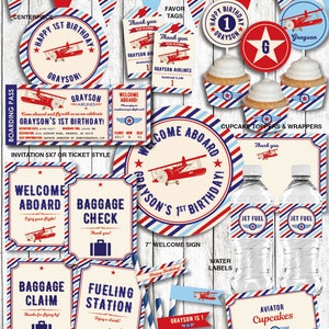 May include: Vintage airplane themed printable party decorations for a first birthday. The set includes a banner, cupcake toppers, water bottle labels, welcome sign, invitation, and more. The colours are red, white, and blue.