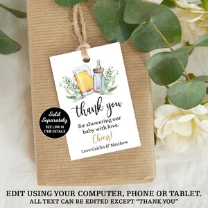 May include: White thank you tag with a watercolor illustration of a beer bottle and a baby bottle with green leaves. The text reads "Thank you for showering our baby with love. Cheers! Love Caitlin & Matthew".