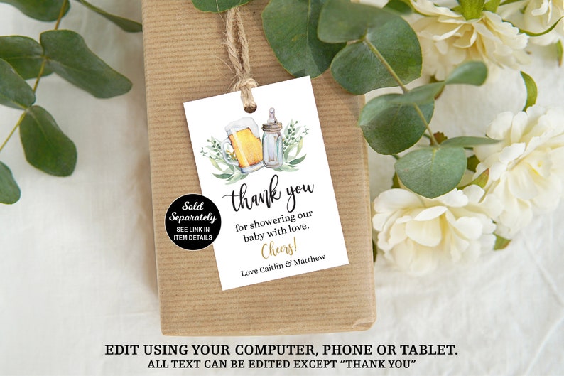 May include: White thank you tag with a watercolor illustration of a beer bottle and a baby bottle with green leaves. The text reads "Thank you for showering our baby with love. Cheers! Love Caitlin & Matthew".