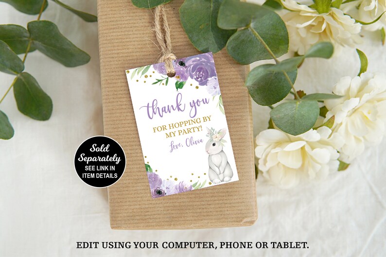 May include: Purple and gold thank you favor tag with a white bunny and floral design. The tag says "Thank you for hopping by my party! Love, Olivia."