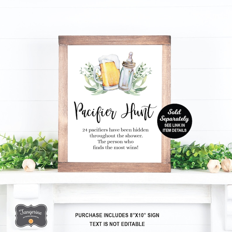 May include: A printable sign for a baby shower game. The sign is white with black text and a watercolor illustration of a beer mug and a baby bottle. The text reads "Pacifier Hunt" and "24 pacifiers have been hidden throughout the shower. The person who finds the most wins!"
