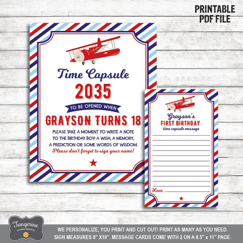 May include: Printable time capsule card set for a first birthday. The card features a red, white and blue striped background with a red aeroplane. The text on the card reads "Time Capsule 2035 To Be Opened When Grayson Turns 18". The card also includes a message card with lines for guests to write messages to the birthday boy.