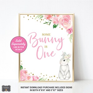 May include: A pink and white printable sign with the text "Some Bunny is One" and a cute bunny rabbit illustration. The sign is decorated with pink flowers and gold glitter.