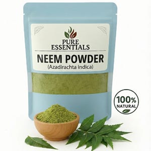 May include: A light blue pouch of neem powder with the text "Pure Essentials" and "Neem Powder (Azadirachta indica)". A small wooden bowl of green powder and neem leaves are next to the pouch. A "100% Natural" seal is on the right.