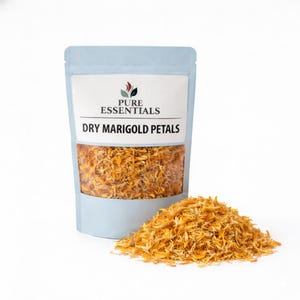 May include: A light blue pouch filled with dried marigold petals, with a small pile of petals in front. The pouch has a white label with the text "Pure Essentials" and "Dry Marigold Petals". The petals are orange and yellow.