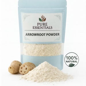 May include: A light blue pouch of arrowroot powder with the text "PURE ESSENTIALS ARROWROOT POWDER". Two arrowroot tubers and a pile of powder are in front of the pouch. A green and white circular label reads "100% NATURAL".