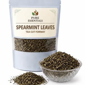May include: A packet of spearmint leaves in tea cut format, with a clear window. A small glass bowl and a pile of spearmint leaves are next to the packet. The packet has the words "Pure Essentials" and "Spearmint Leaves".