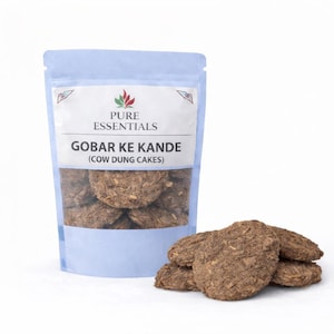 May include: A package of cow dung cakes, labeled "Gobar Ke Kande" in a clear, resealable bag. Several brown, irregularly shaped cakes are stacked beside the bag. The packaging features the "Pure Essentials" logo.