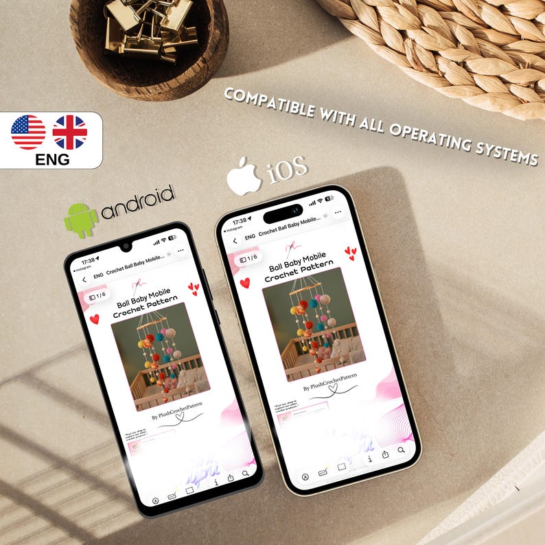 May include: Two smartphones displaying a crochet pattern for a baby mobile. The mobile features colorful pom-poms. The image includes the text "Ball Baby Mobile Crochet Pattern" and mentions compatibility with all operating systems.