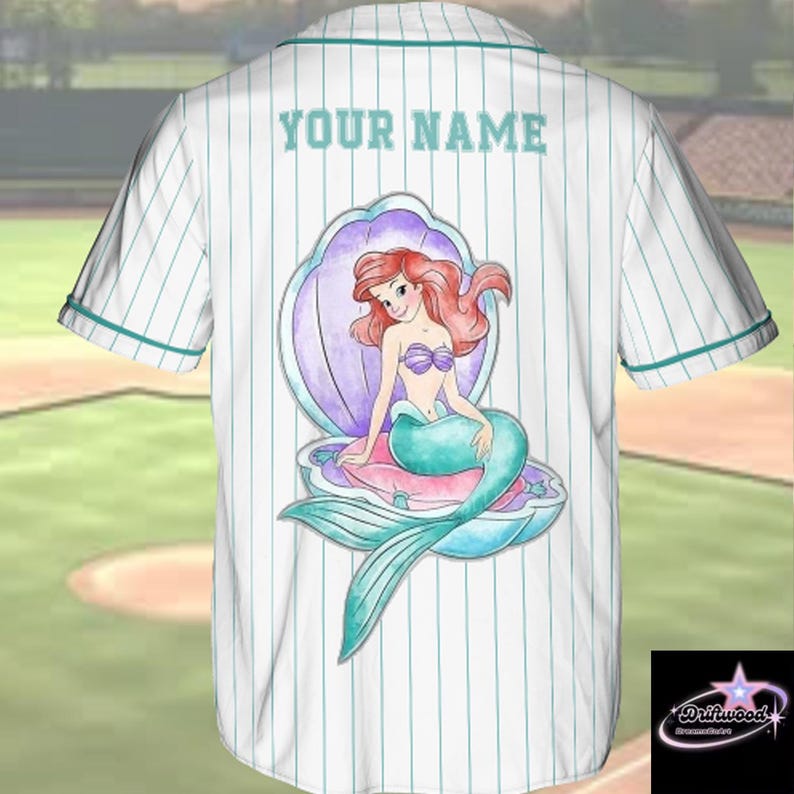 A white baseball jersey with a graphic of a mermaid character on the back.