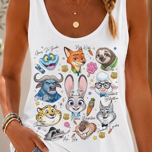 a woman wearing a white tank top with cartoon characters on it
