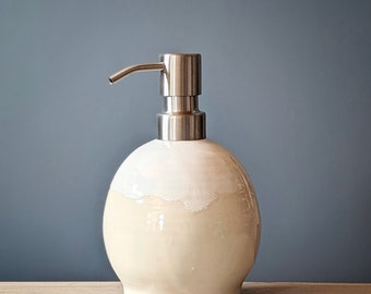 White and cream soap dispenser