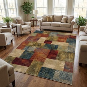 以下が含まれることがあります： 赤、青、金、ベージュの色合いの幾何学模様の長方形ラグ。 ラグは、リビングルームの雰囲気に視覚的な面白さを加える、テクスチャード加工されたラインを備えた繰り返しの正方形のデザインが特徴です。