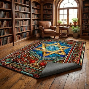 May include: A rectangular area rug with a stained glass design featuring a blue Star of David, surrounded by colorful floral and geometric patterns. The rug is displayed on a wooden floor in a room with bookshelves.