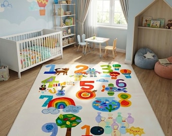 May include: A colorful children's room featuring a large rectangular rug with numbers and illustrations. The rug has a cream background with vibrant numbers, animals, and objects. The room includes a crib, small table, chairs, and decorative wall art.